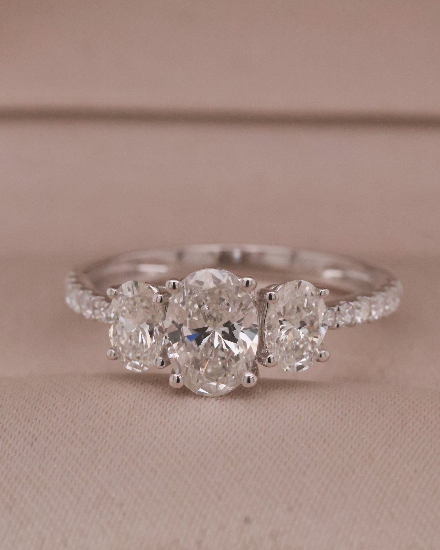 White gold 10k Oval 3 stones with pave